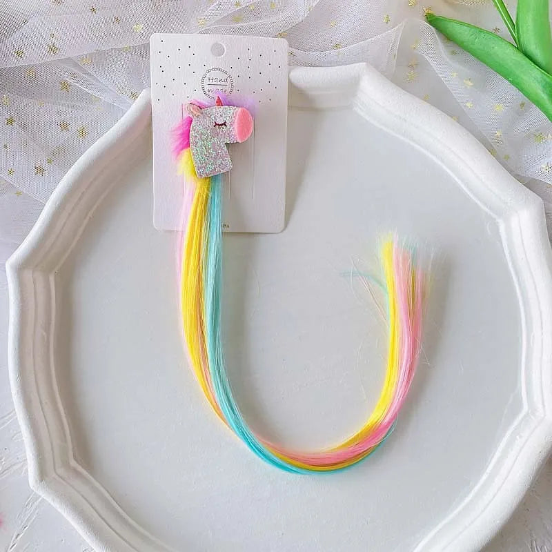 Unicorn colorful hair clips – fun rainbow party favors and accessories for kids.