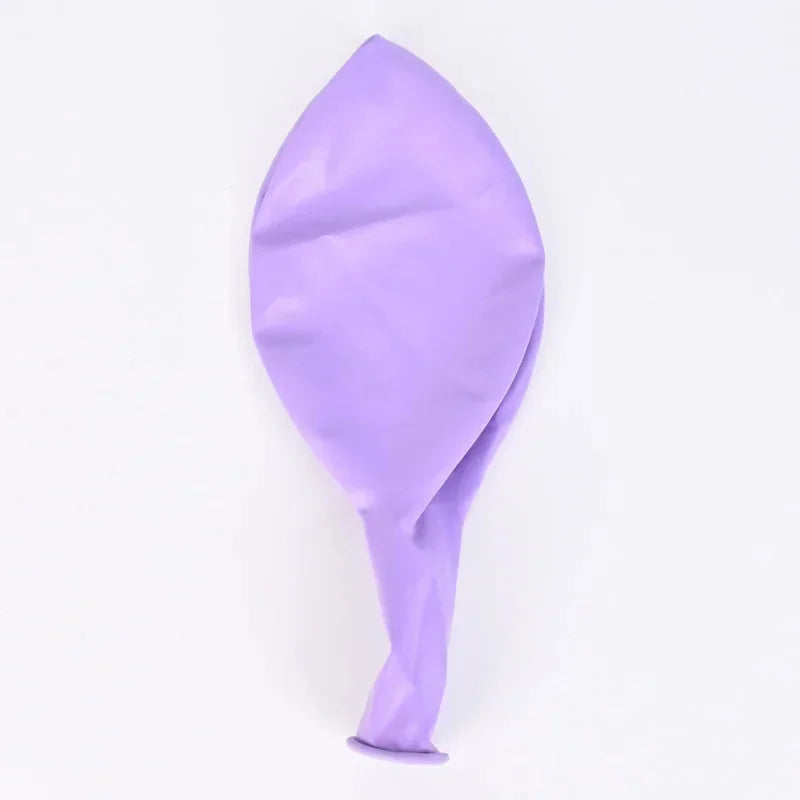 Pastel macaron balloons with paper tassel garland for parties and celebrations.