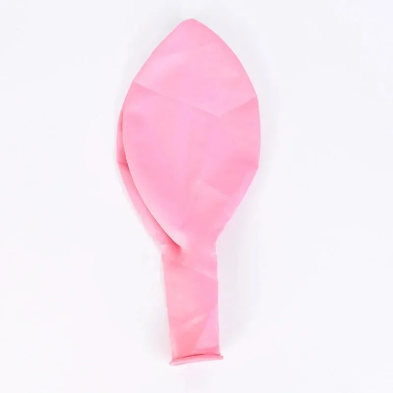 Pastel macaron balloons with paper tassel garland for parties and celebrations.