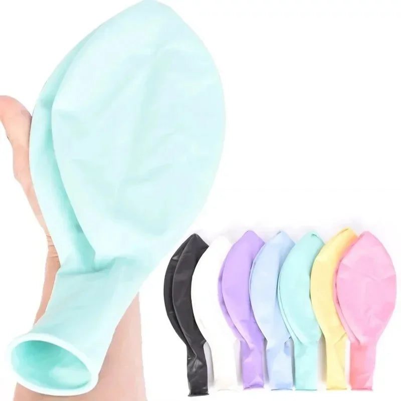 Pastel macaron balloons with paper tassel garland for parties and celebrations.