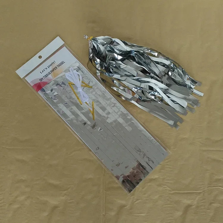 Pastel macaron balloons with paper tassel garland for parties and celebrations.