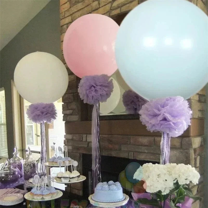 Pastel macaron balloons with paper tassel garland for parties and celebrations.