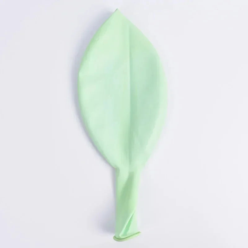 Pastel macaron balloons with paper tassel garland for parties and celebrations.